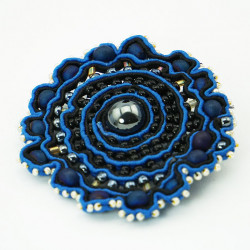 Brooch with colored glass...